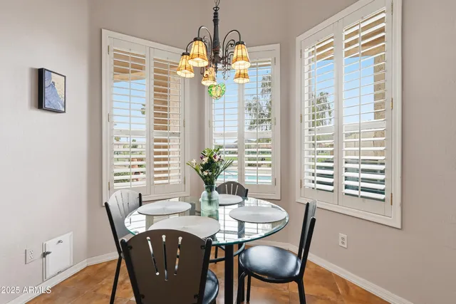 a living room with furniture and a view of kitchen
