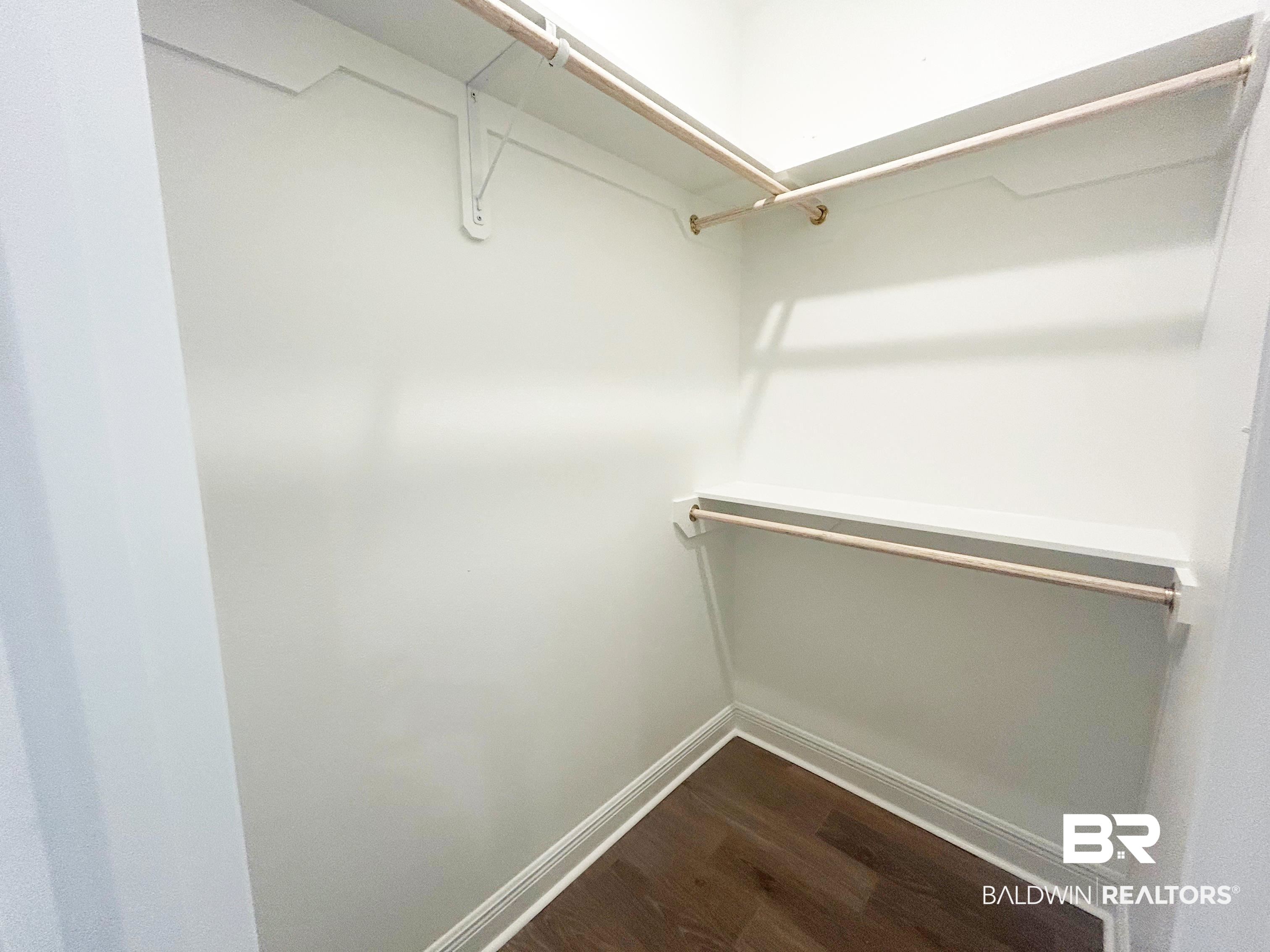 873 Sumter Loop Foley, AL 36535 - Photo 16 of 26 Walk in closet with dark wood finished floors