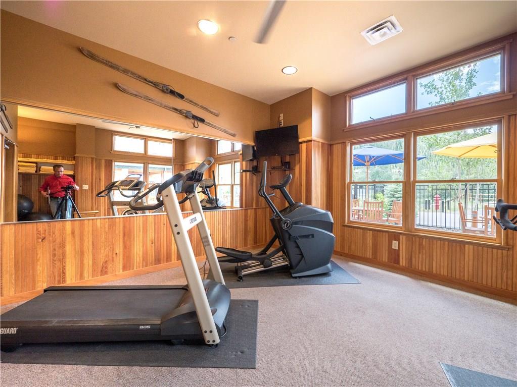 129 River Run Road, Unit 8064 Keystone, CO 80435 - Photo 20 of 21 a living room with gym equipment and a large window