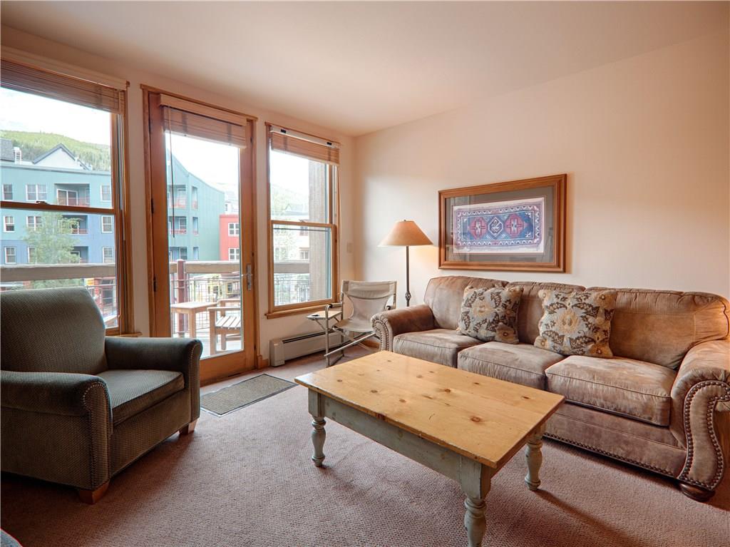 129 River Run Road, Unit 8064 Keystone, CO 80435 - Photo 3 of 21 a living room with furniture and a large window