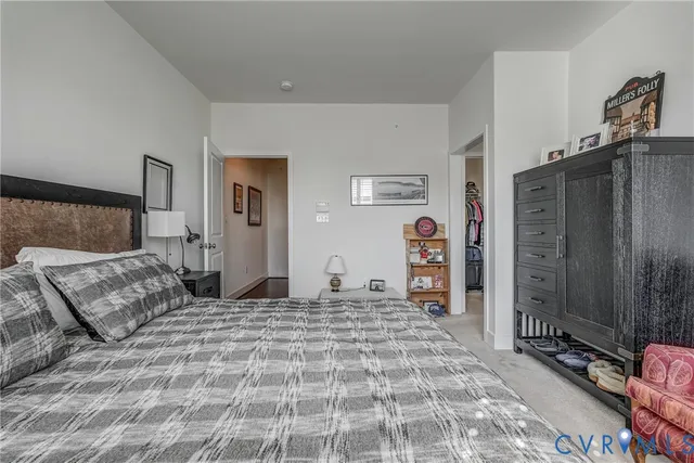 a bedroom with a bed and a mirror