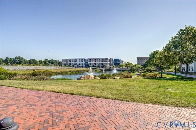 a view of a swimming pool and a yard