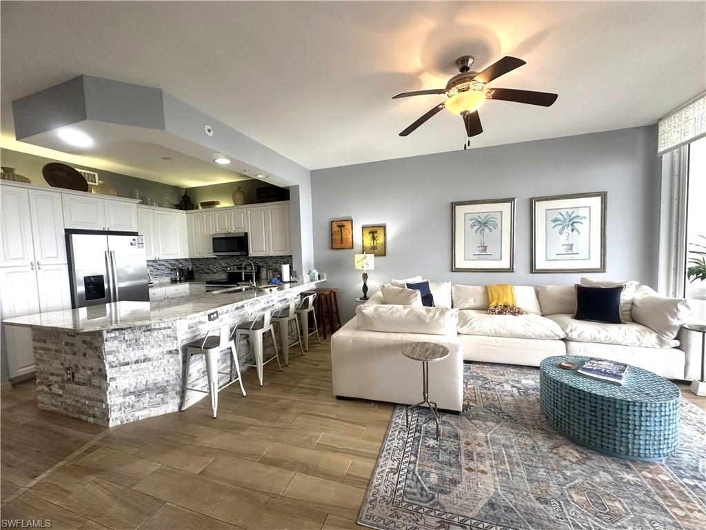 470 Launch Circle, Unit V503 Naples, FL 34108 - Photo 15 of 30 a living room with furniture kitchen view and a window