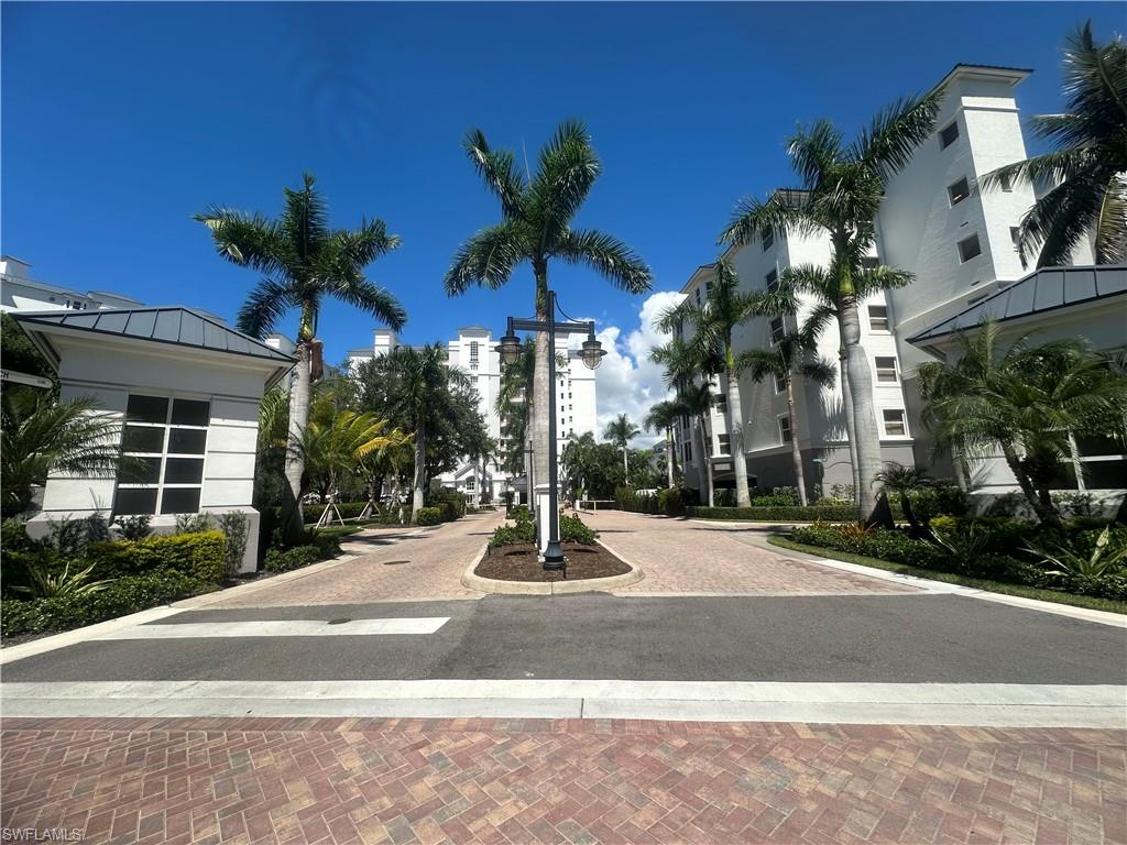 470 Launch Circle, Unit V503 Naples, FL 34108 - Photo 2 of 30 a view of a building with a yard