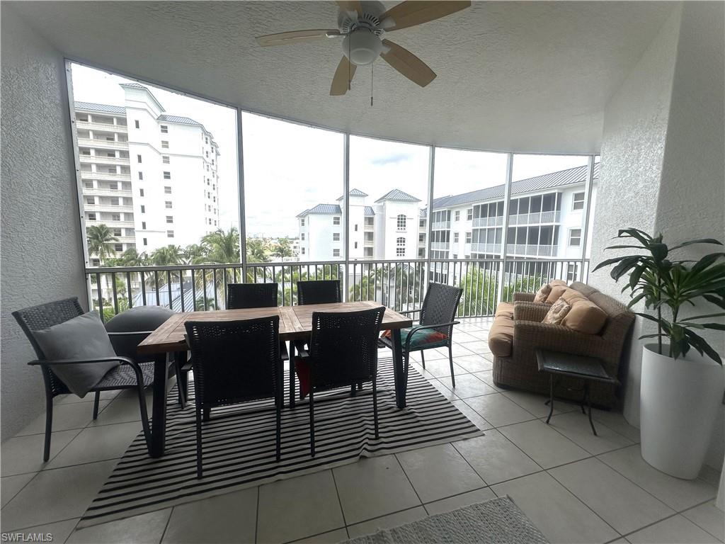 470 Launch Circle, Unit V503 Naples, FL 34108 - Photo 7 of 30 a view of a dining room with furniture window and outside view
