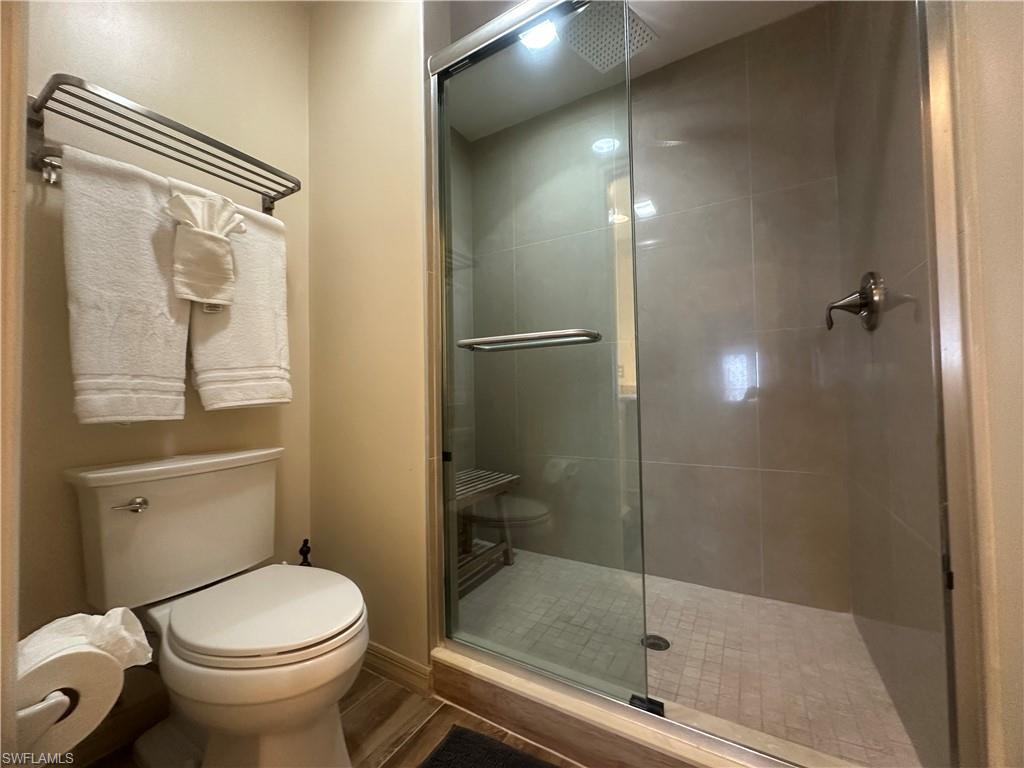 470 Launch Circle, Unit V503 Naples, FL 34108 - Photo 10 of 30 a bathroom with a shower and toilet