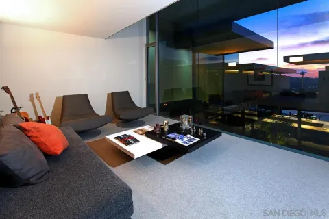 a living room with furniture fireplace and flat screen tv