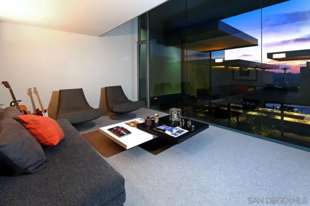 a living room with furniture fireplace and flat screen tv