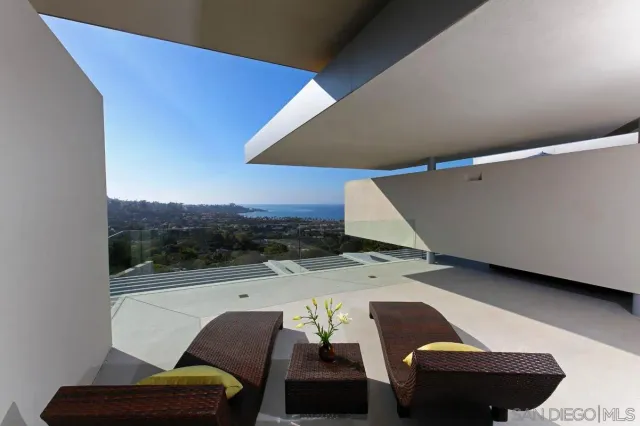 a living room with furniture and a patio