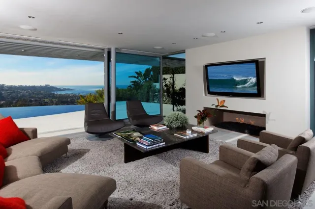 a dining room with furniture and a potted plant