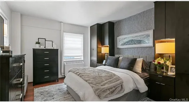 a bedroom with a bed and a closet