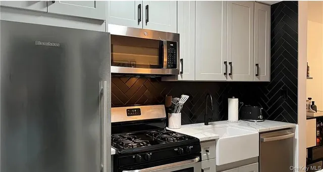 a kitchen with a stove and a microwave
