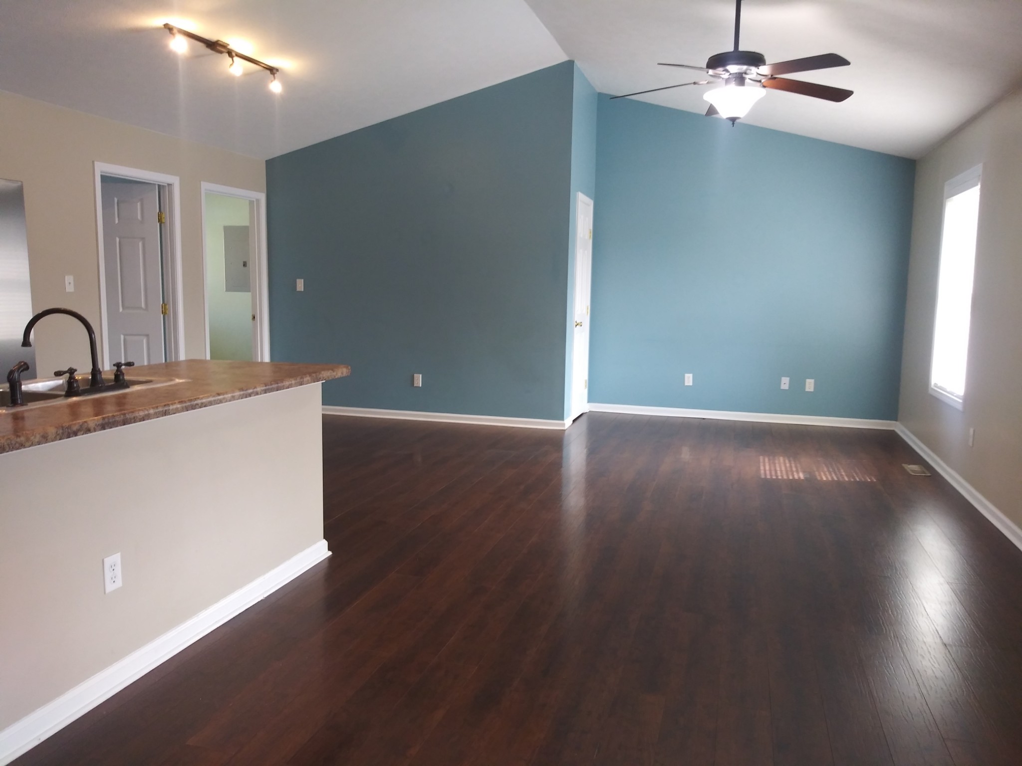 5330 Long Branch Road Tennessee Ridge, TN 37178 - Photo 24 of 57 a view of a livingroom with a ceiling fan and wooden floor