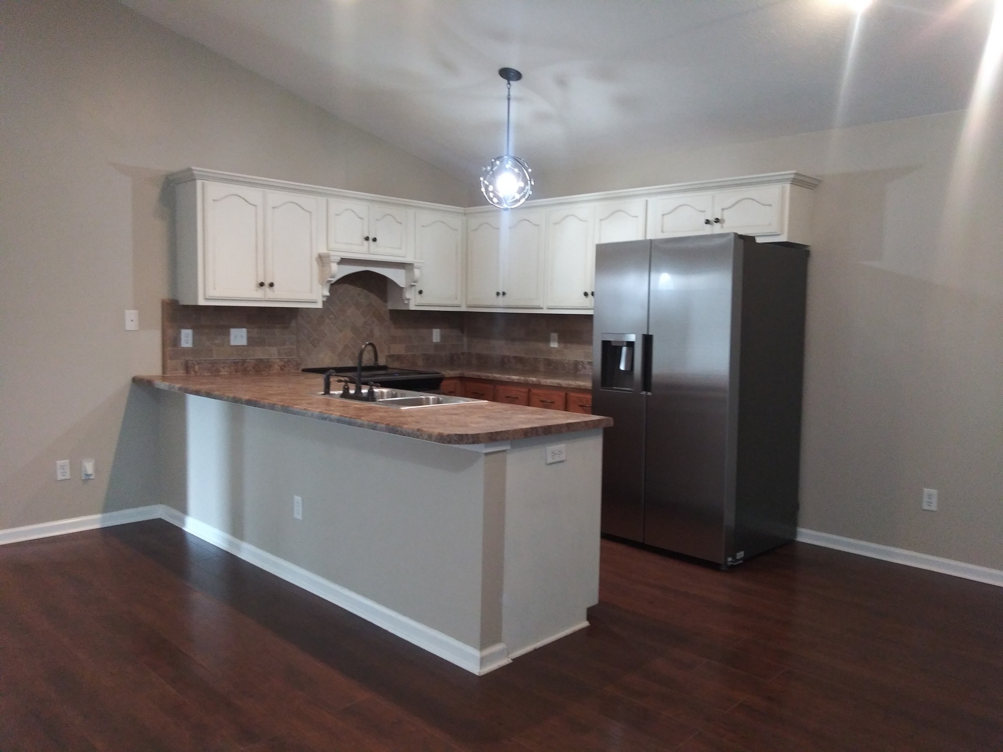 5330 Long Branch Road Tennessee Ridge, TN 37178 - Photo 26 of 57 a kitchen with stainless steel appliances granite countertop a refrigerator a sink and a stove