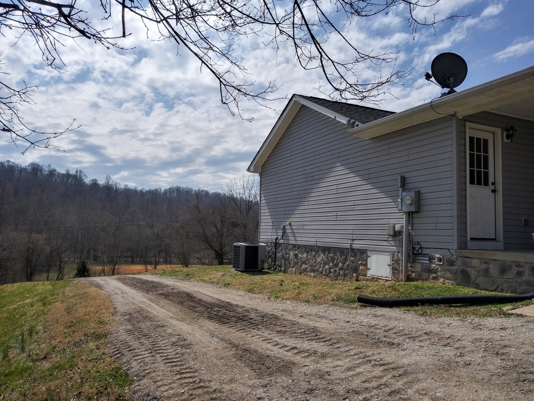 5330 Long Branch Road Tennessee Ridge, TN 37178 - Photo 49 of 57 a front view of a house with garden
