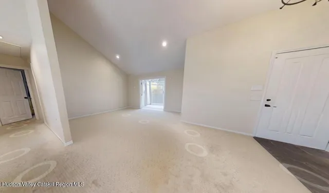 a view of empty room with windows