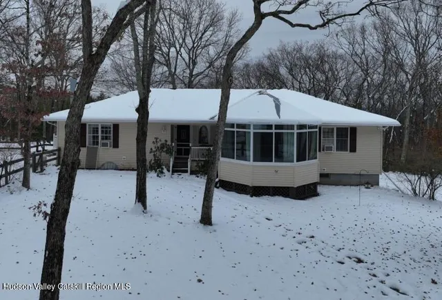 a house with trees in the background
