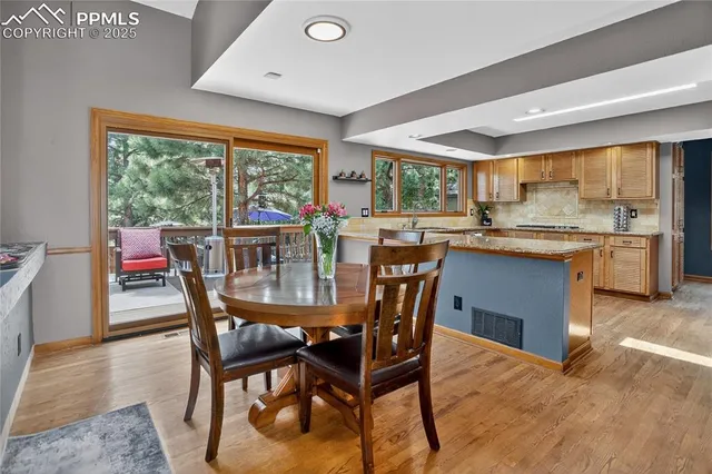 a view of a dining room and a table chairs