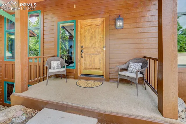 a building outdoor space with patio furniture and white walls