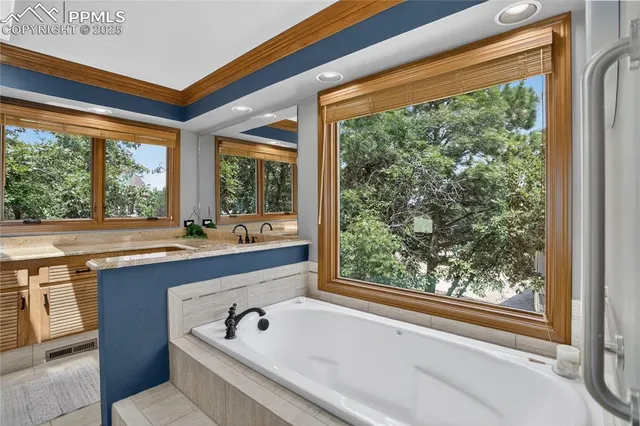 a bath tub sitting in front of a window