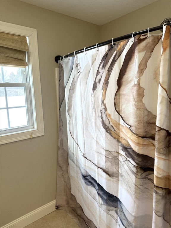 134 Granger Street Springfield, MA 01119 - Photo 8 of 15 a view of walk in closet with clothes and shoes