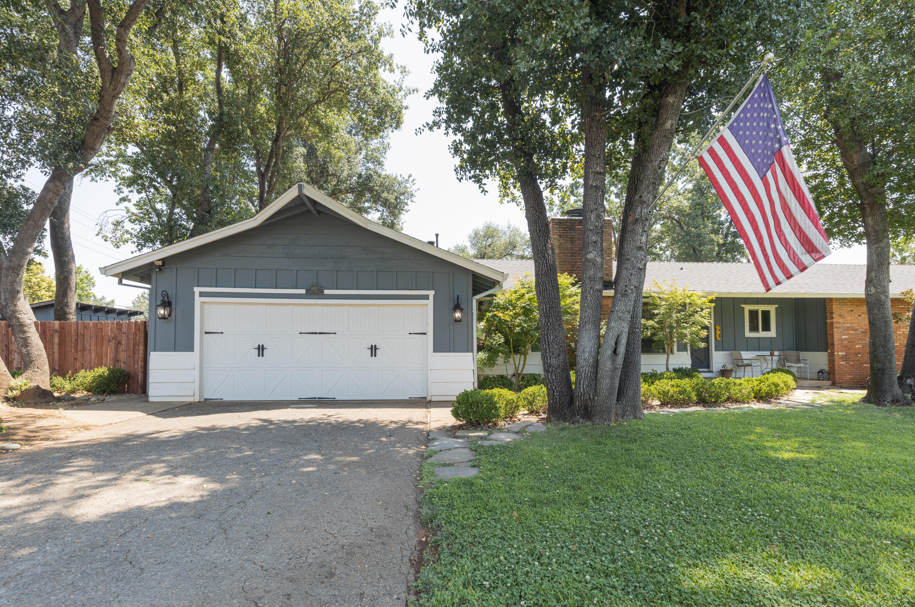 a front view of house with yard and green space