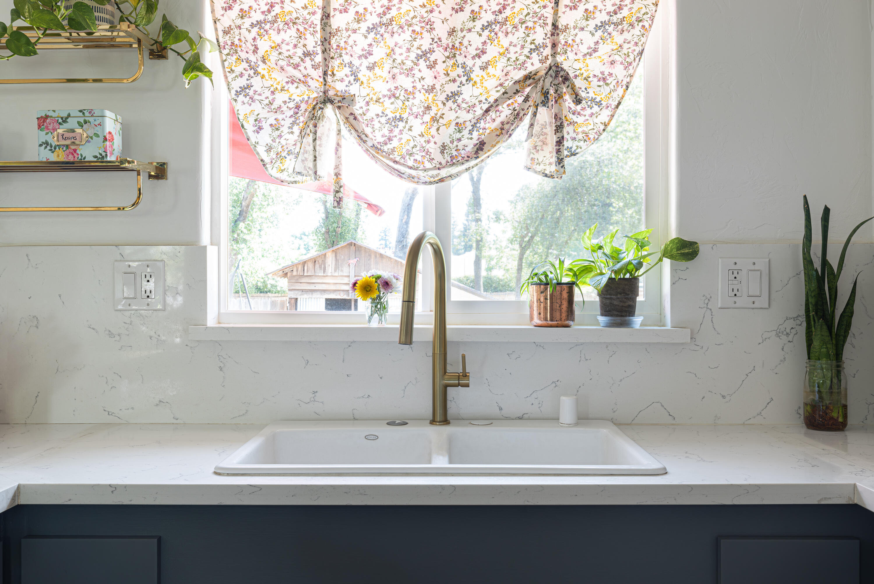 4001 Alta Mesa Drive Redding, CA 96002 - Photo 11 of 42 a bathroom with a sink and a potted plant