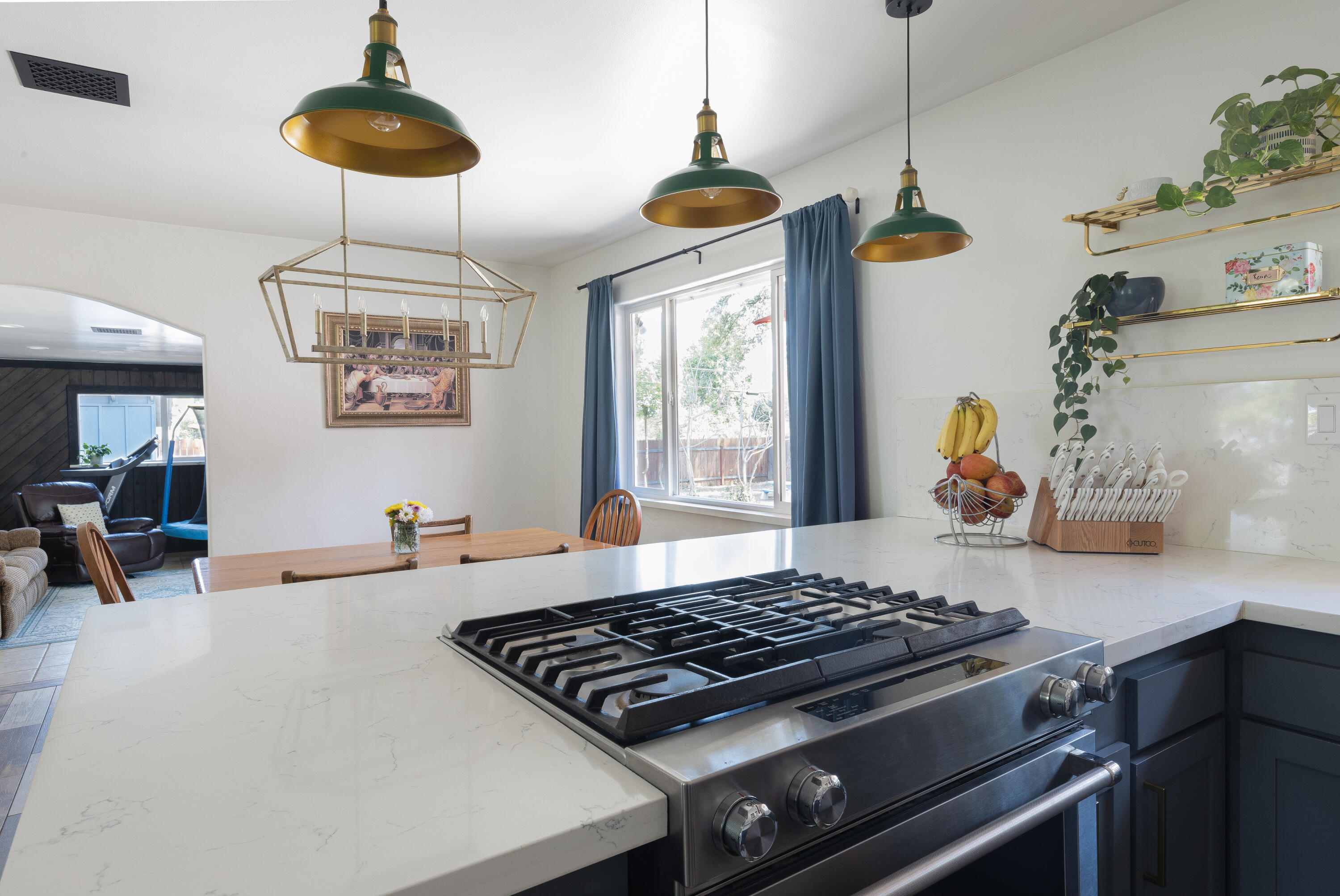 4001 Alta Mesa Drive Redding, CA 96002 - Photo 12 of 42 a kitchen with a stove and a chandelier