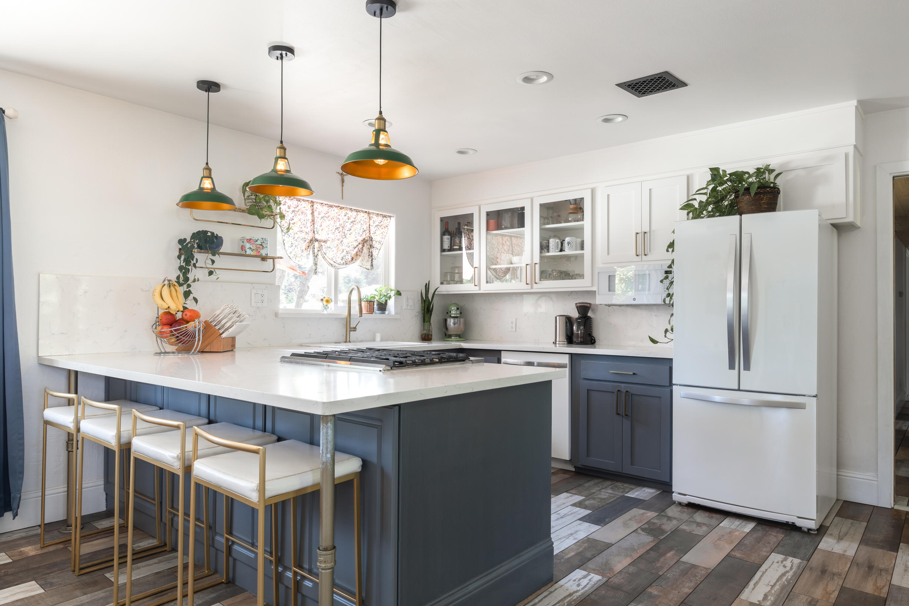 4001 Alta Mesa Drive Redding, CA 96002 - Photo 13 of 42 a kitchen with stainless steel appliances granite countertop a sink a refrigerator and a wooden floor