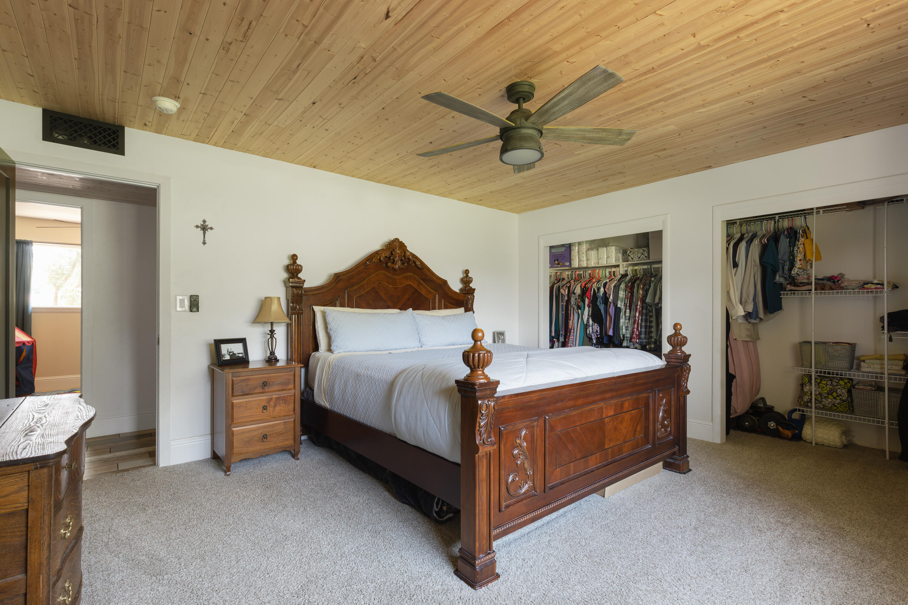 4001 Alta Mesa Drive Redding, CA 96002 - Photo 20 of 42 a bedroom with a bed and a chandelier