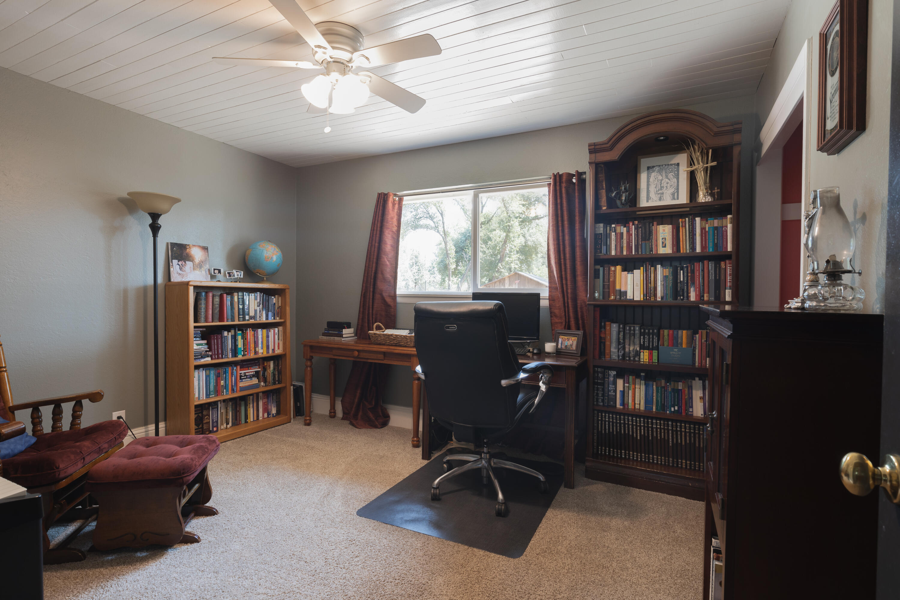 4001 Alta Mesa Drive Redding, CA 96002 - Photo 25 of 42 a view of a workspace with furniture and a bookshelf