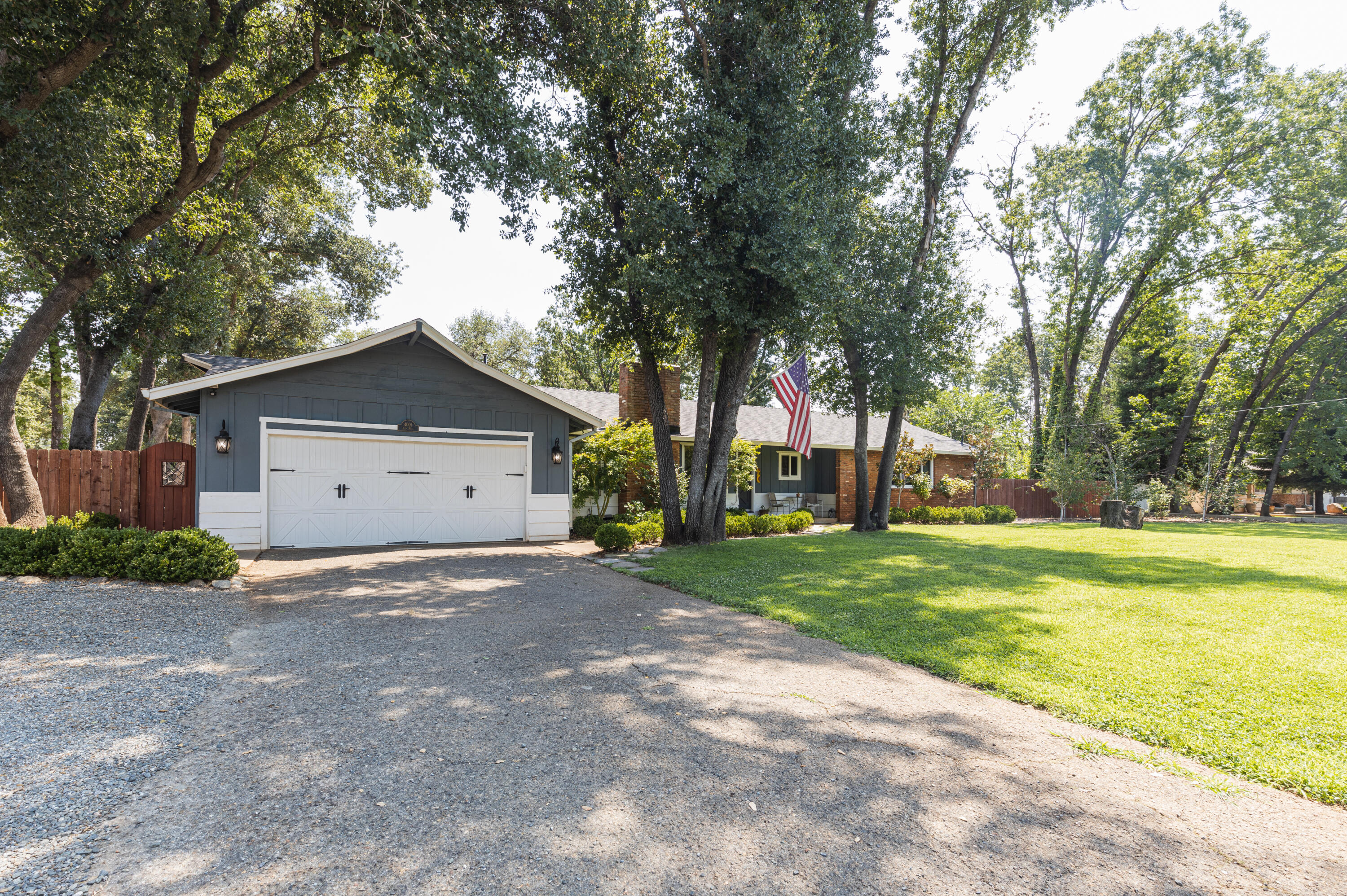 4001 Alta Mesa Drive Redding, CA 96002 - Photo 40 of 42 a view of a house with a yard and large trees