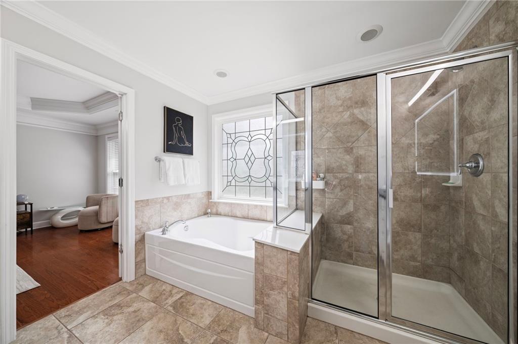 2872 Overlook Way Northeast Atlanta, GA 30324 - Photo 22 of 47 a bathroom with a bathtub and a shower