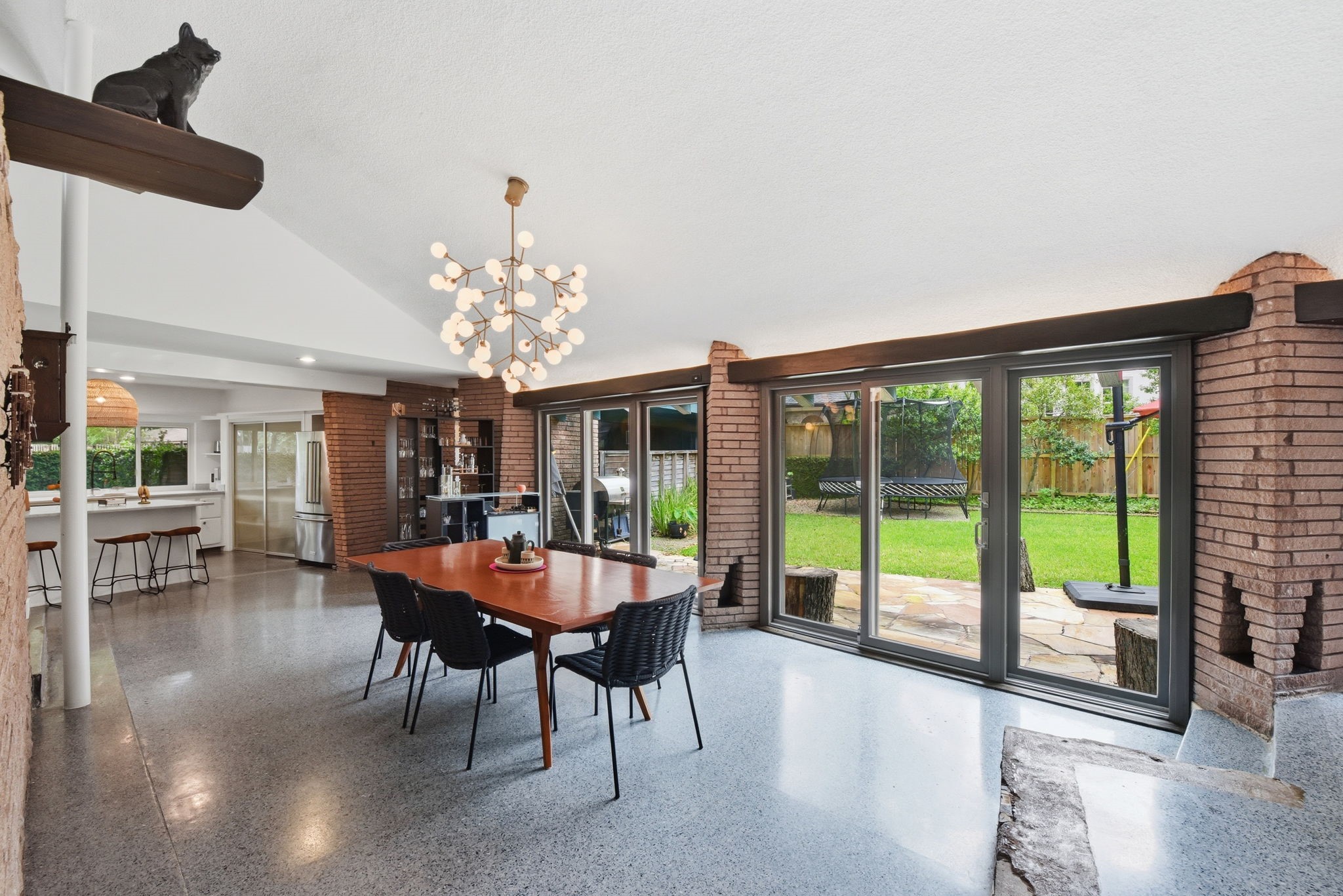 4603 Ivanhoe Street Houston, TX 77027 - Photo 13 of 50 a dining room with furniture a chandelier and large windows