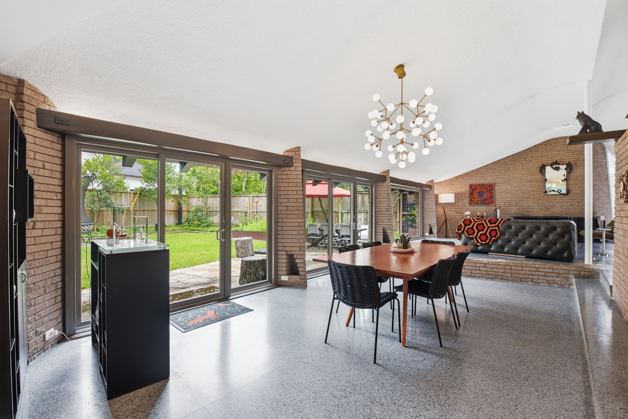 4603 Ivanhoe Street Houston, TX 77027 - Photo 14 of 50 a dining room with furniture a chandelier and a rug