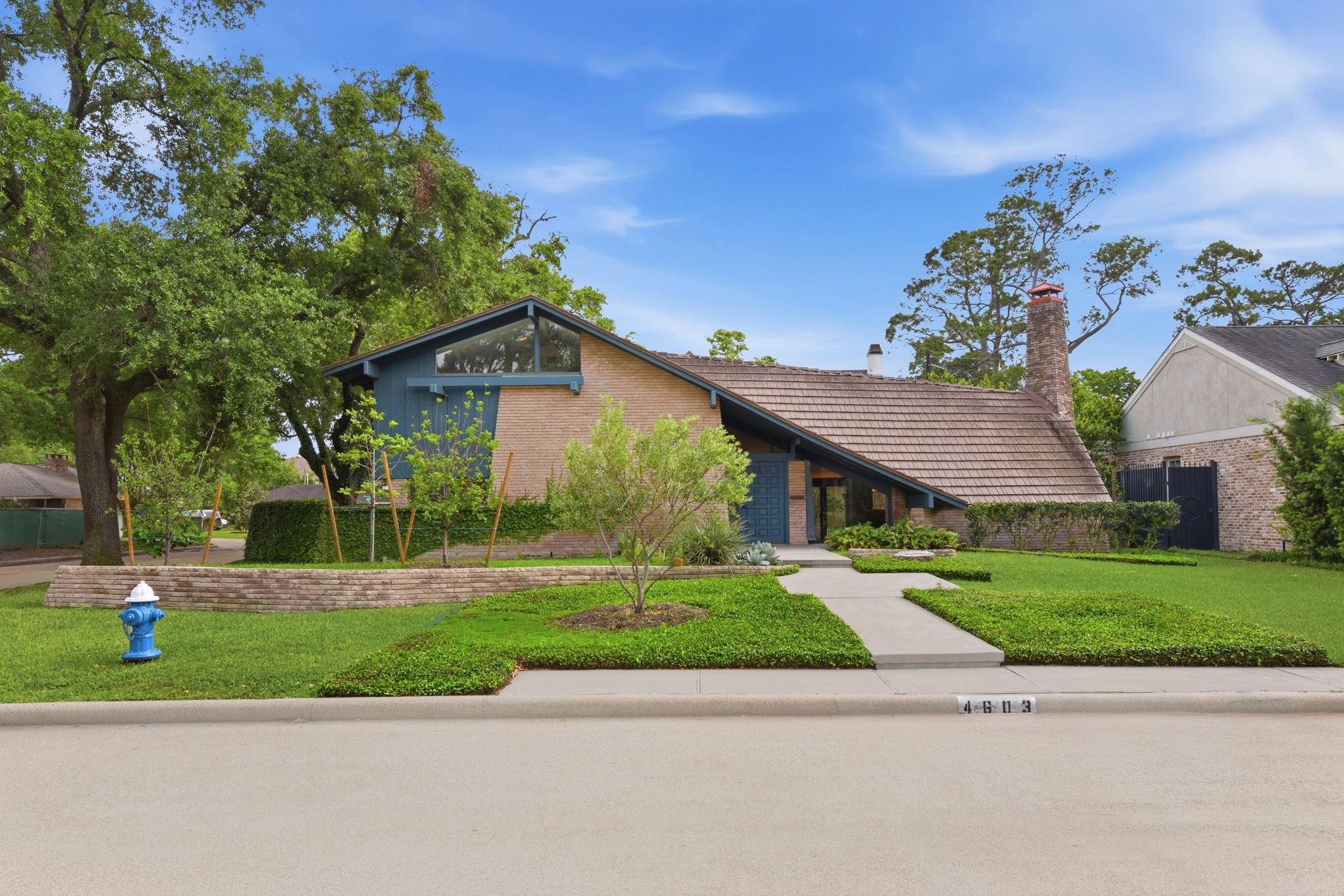 4603 Ivanhoe Street Houston, TX 77027 - Photo 2 of 50 a front view of a house with a yard and a garage