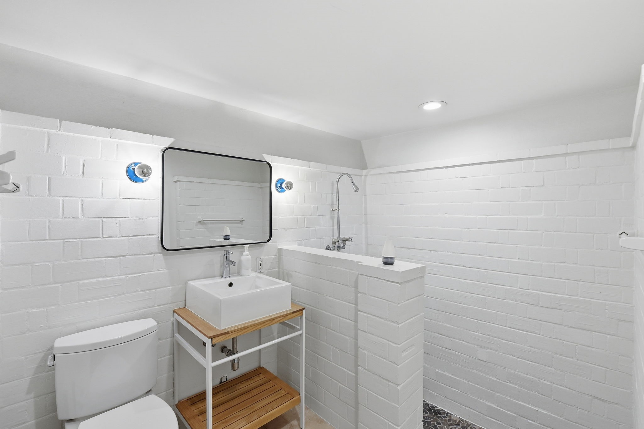 4603 Ivanhoe Street Houston, TX 77027 - Photo 39 of 50 a bathroom with a sink a toilet and mirror