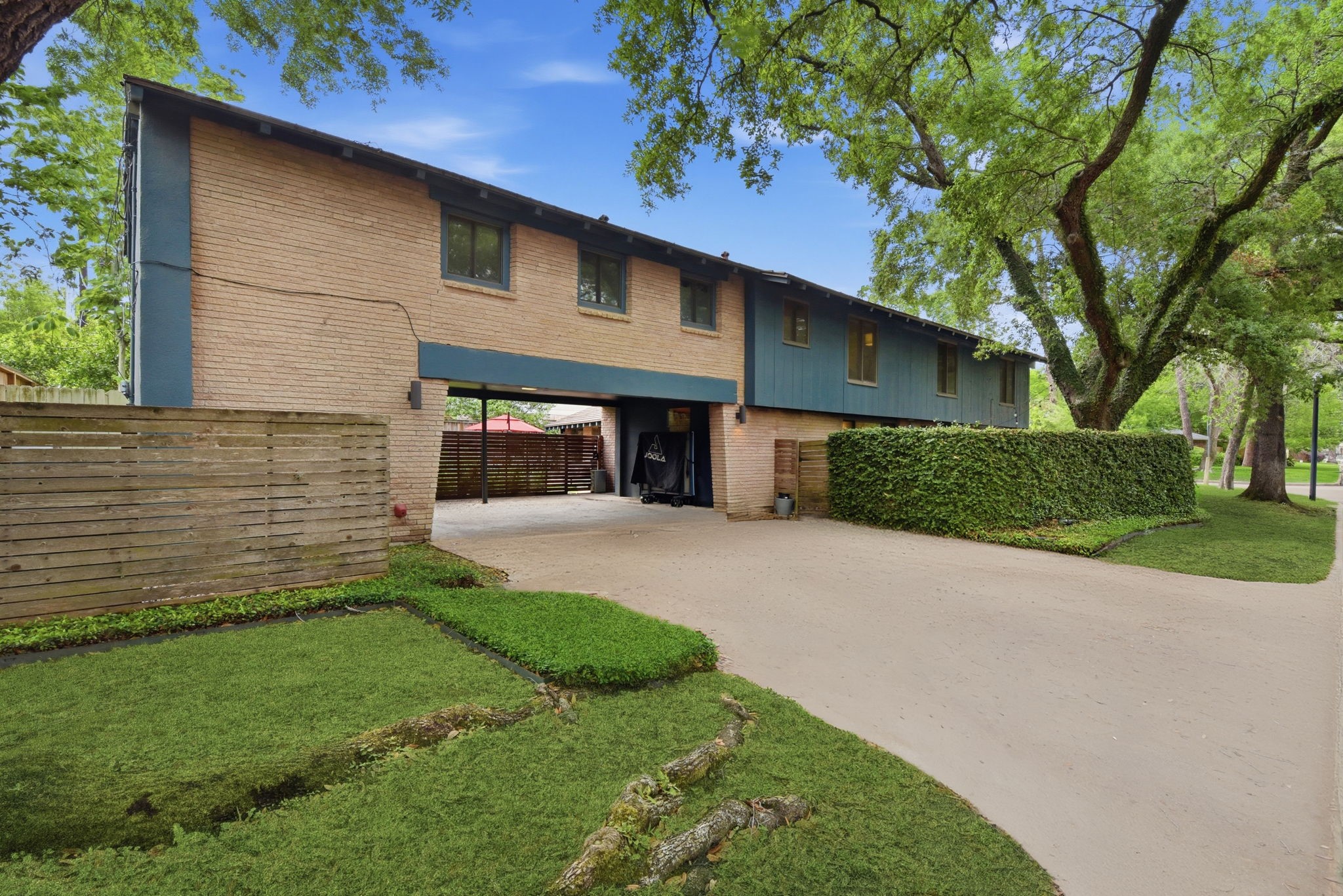 4603 Ivanhoe Street Houston, TX 77027 - Photo 44 of 50 a front view of a house with a yard and garage