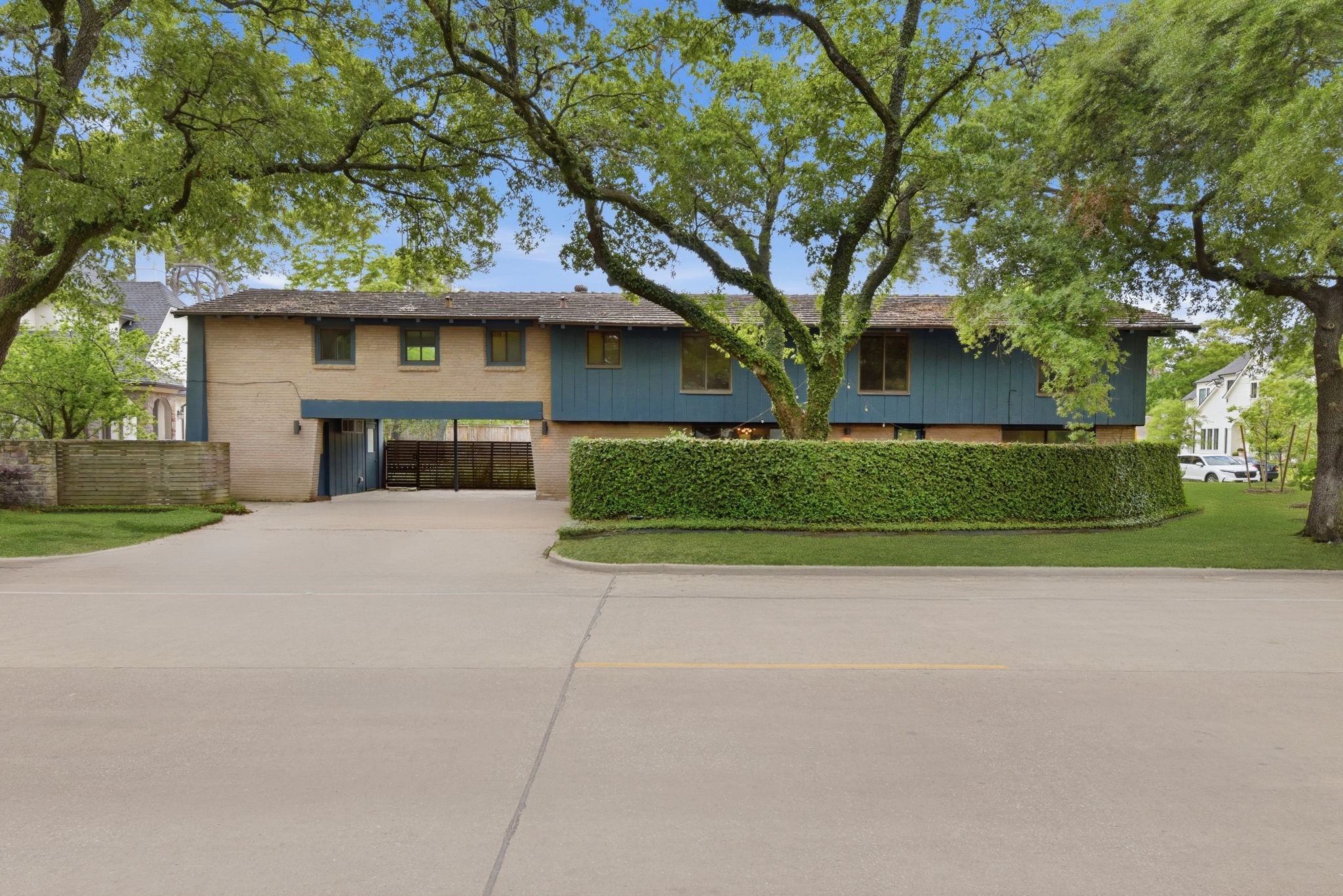 4603 Ivanhoe Street Houston, TX 77027 - Photo 45 of 50 a front view of a house with a yard and garage