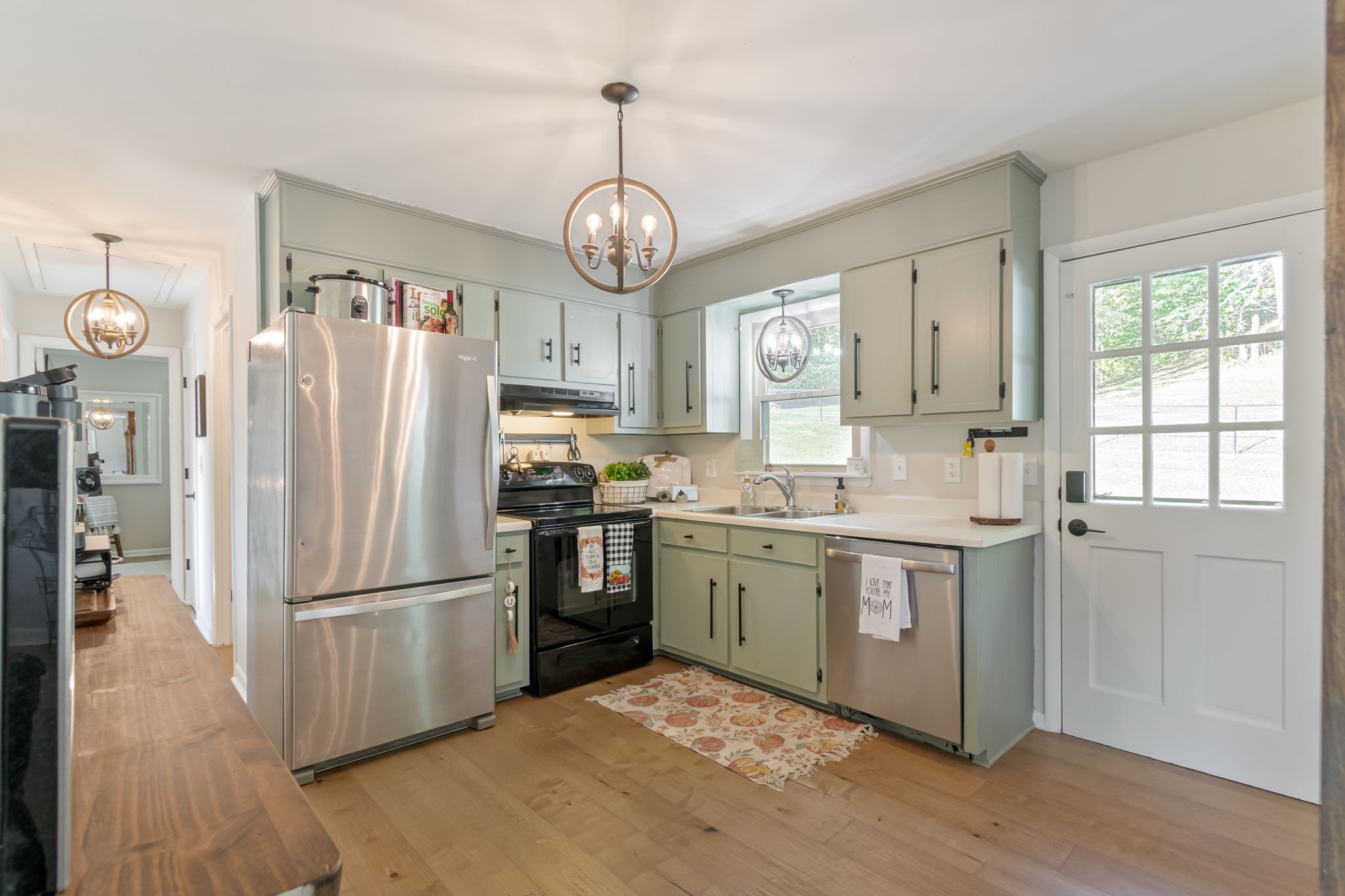 260 West Fork Road Mount Pleasant, TN 38474 - Photo 19 of 54 a kitchen with stainless steel appliances granite countertop a refrigerator a sink dishwasher a stove and a refrigerator with wooden floor