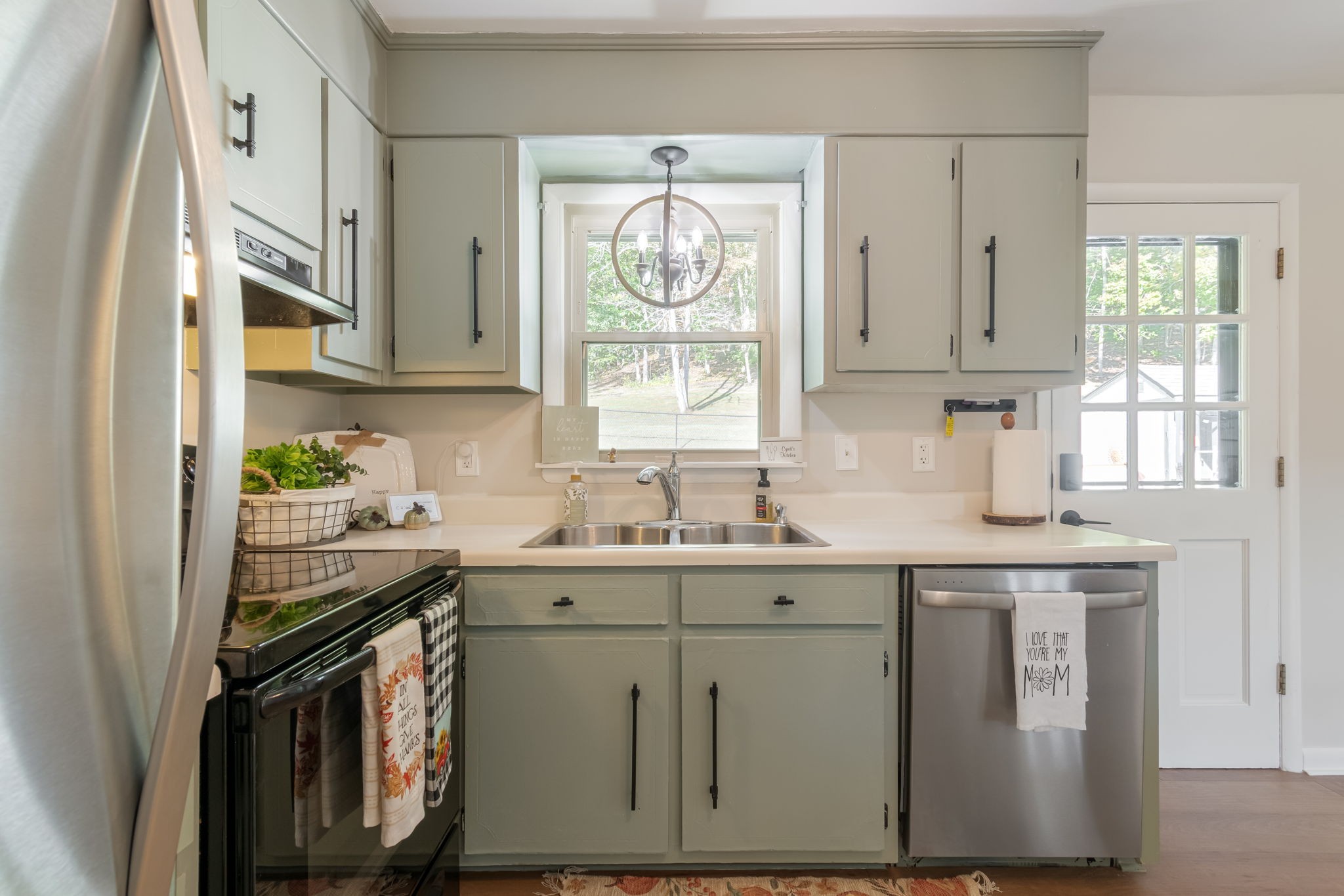 260 West Fork Road Mount Pleasant, TN 38474 - Photo 20 of 54 a kitchen with stainless steel appliances granite countertop a sink stove and cabinets