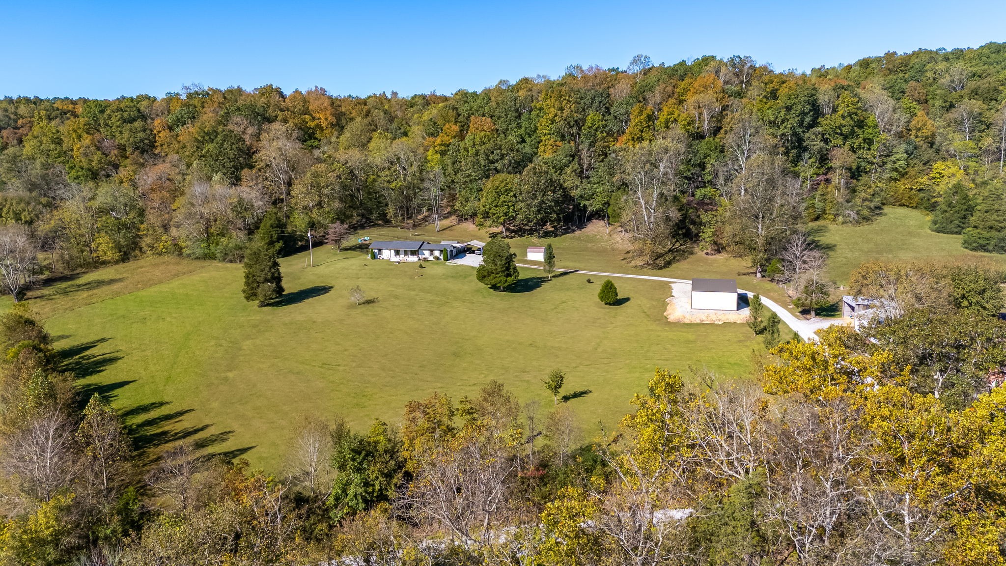 260 West Fork Road Mount Pleasant, TN 38474 - Photo 22 of 54 a view of a lake with a mountain in the background