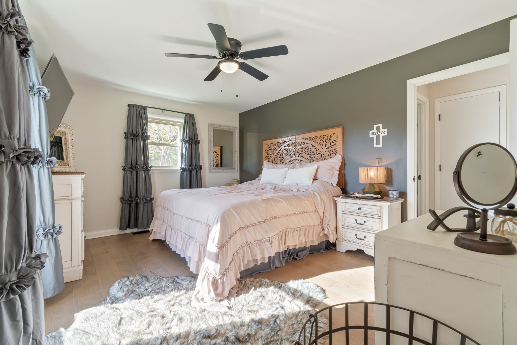 260 West Fork Road Mount Pleasant, TN 38474 - Photo 36 of 54 a bedroom with a bed and a chandelier