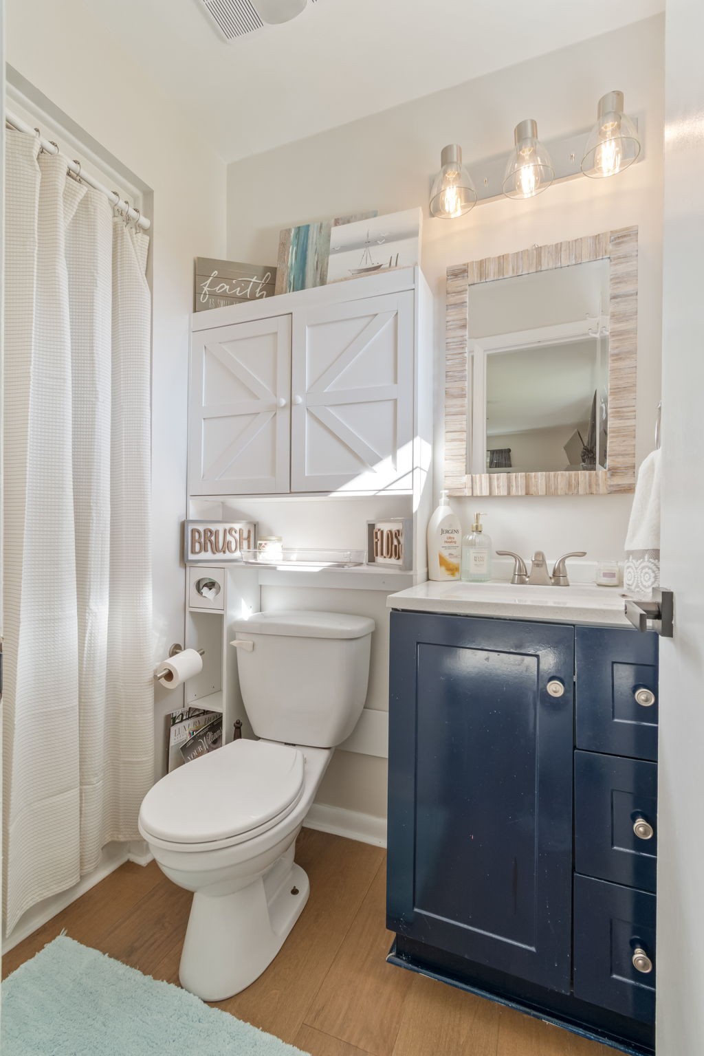 260 West Fork Road Mount Pleasant, TN 38474 - Photo 38 of 54 a bathroom with a sink toilet vanity and shower