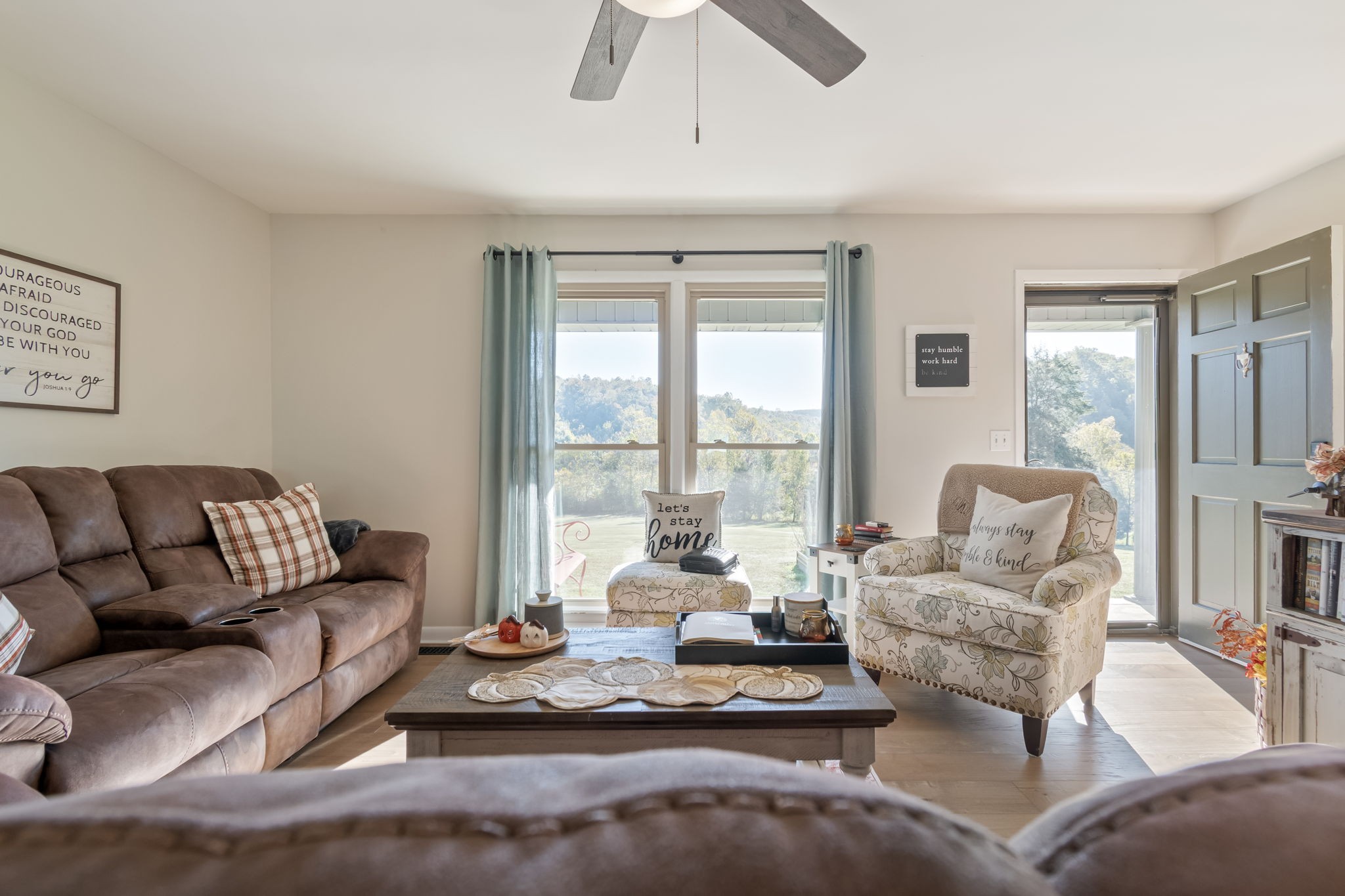 260 West Fork Road Mount Pleasant, TN 38474 - Photo 4 of 54 a living room with furniture large windows and a chandelier