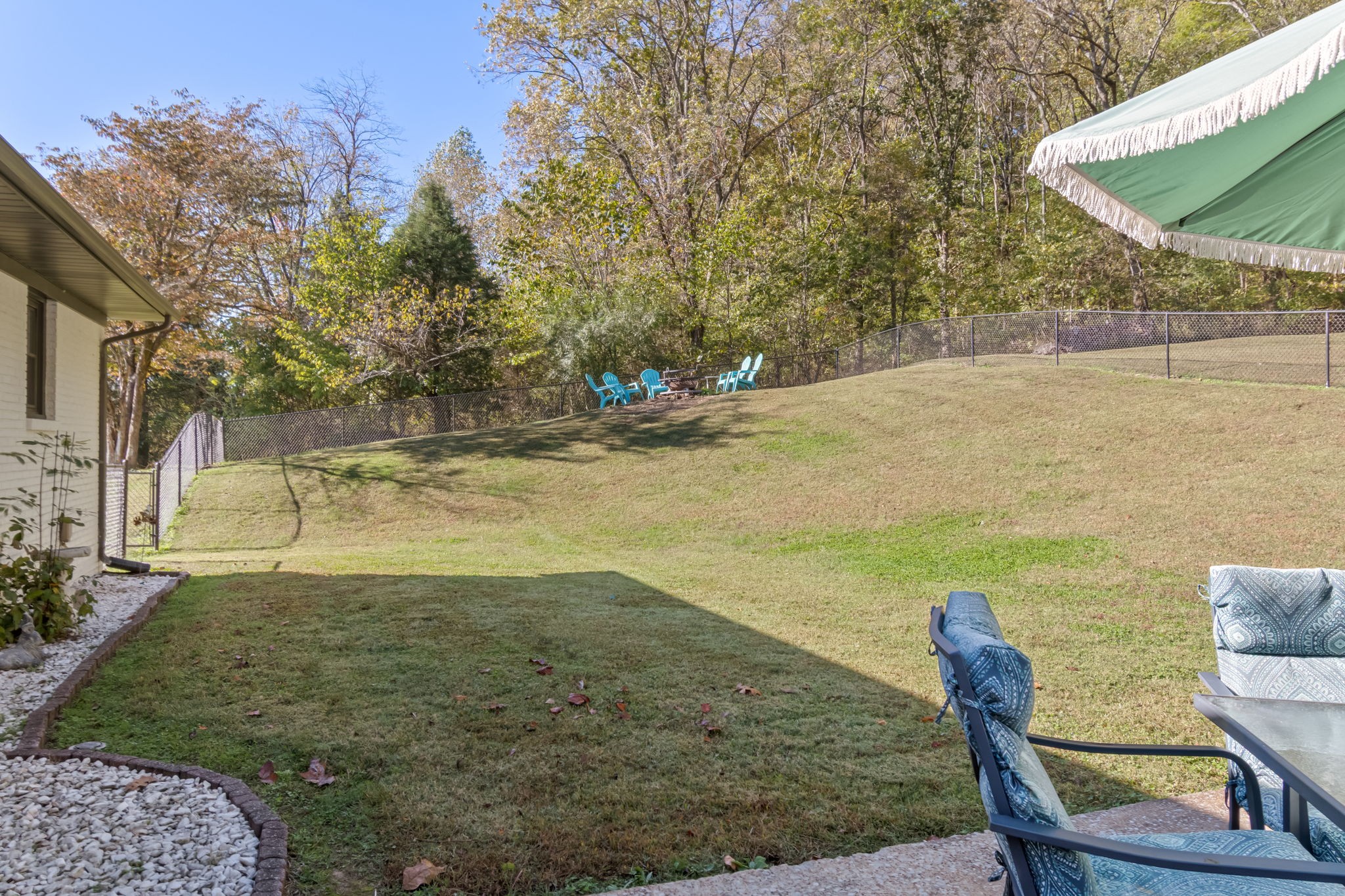 260 West Fork Road Mount Pleasant, TN 38474 - Photo 45 of 54 a view of a lake with a table and chairs in the patio