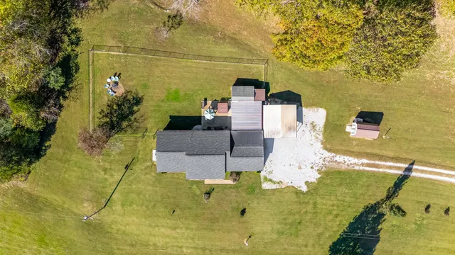 a view of a sign board with yard