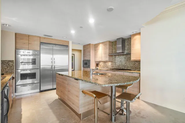 a view of living room with furniture and wooden floor