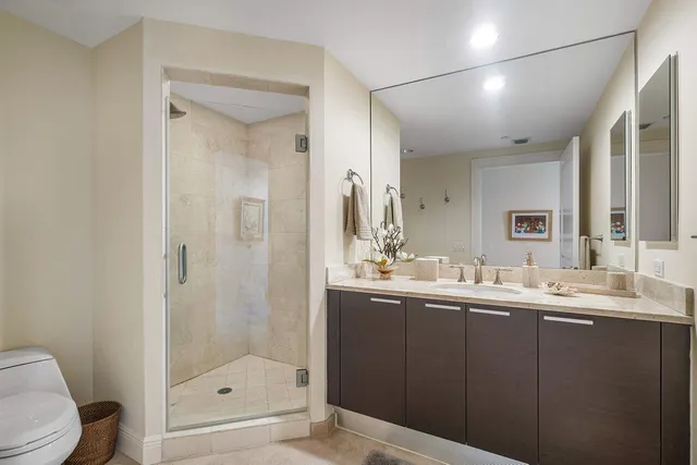 a bathroom with a sink toilet and mirror