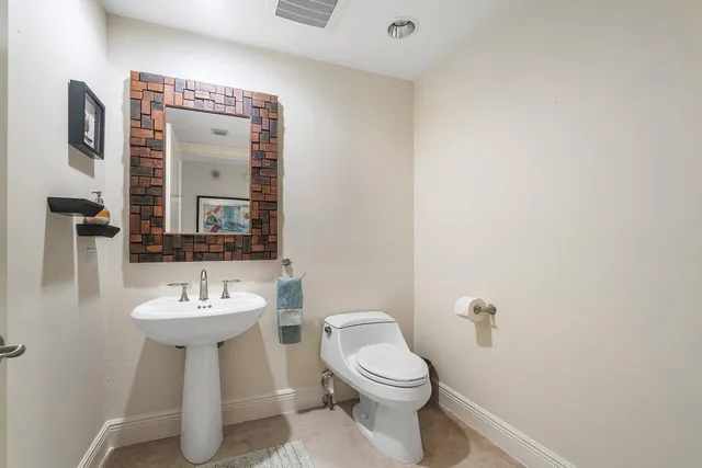 a bedroom with a bed couch and window